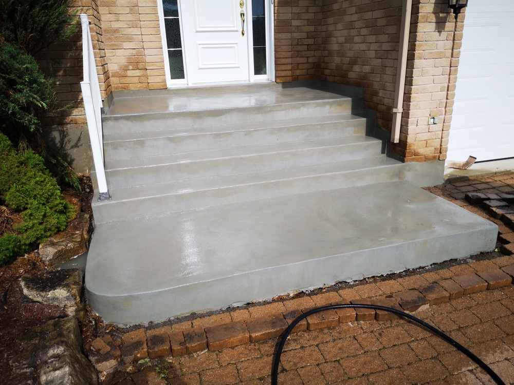 Example of different steps to properly prepare and resurface an old chipped concrete staircase to a renewed finish.
