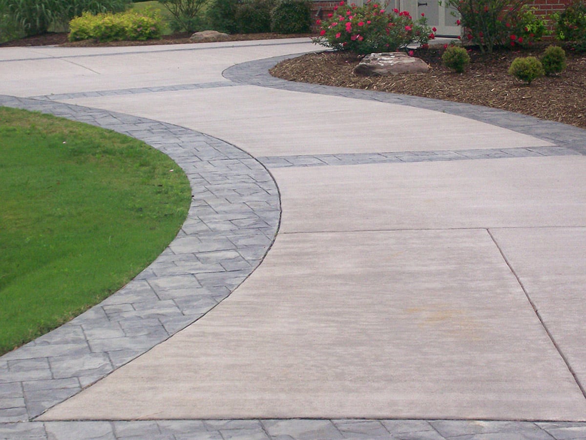 Newly constructed driveway in a garden using beautiful concrete patio design